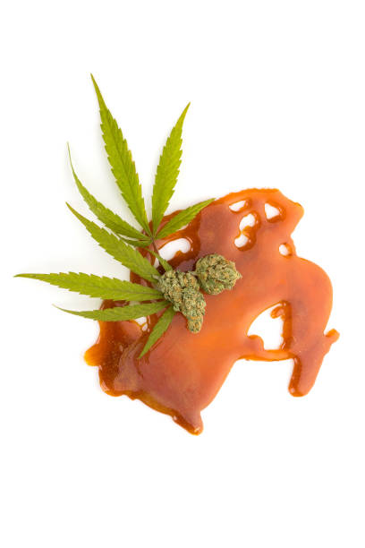 istock Cannabis concentrate shatter, bud and leaves. 1126168812