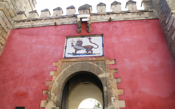 Puerta del Leon (Gate of the Lion), main entrance of Alcazar of Seville, Seville, Spain Puerta del Leon (Gate of the Lion), main entrance of Alcazar of Seville, Seville, Spain el alcazar palace seville stock pictures, royalty-free photos & images