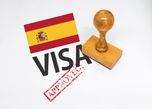 Spain Visa Approved with Rubber Stamp and flag