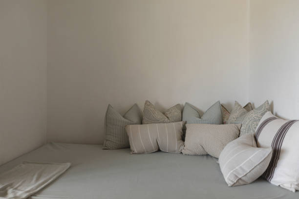 istock Pillows arranged on a bed in bedroom 1126173035