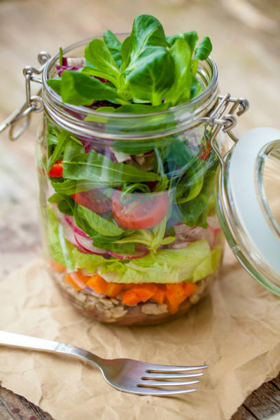 istock Salad in mason jar for lunch to go 1126173672