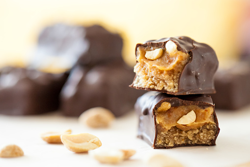 Healthy version of chocolate bars with peanuts and dates filling