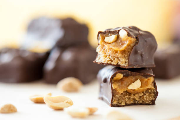 chocolate bars with peanuts and dates Healthy version of chocolate bars with peanuts and dates filling chocolate bar photos stock pictures, royalty-free photos & images