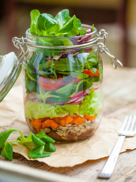 istock Salad in mason jar for lunch to go 1126173787