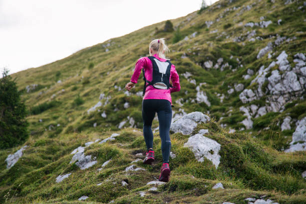 istock Female running in the mountains 1126174656