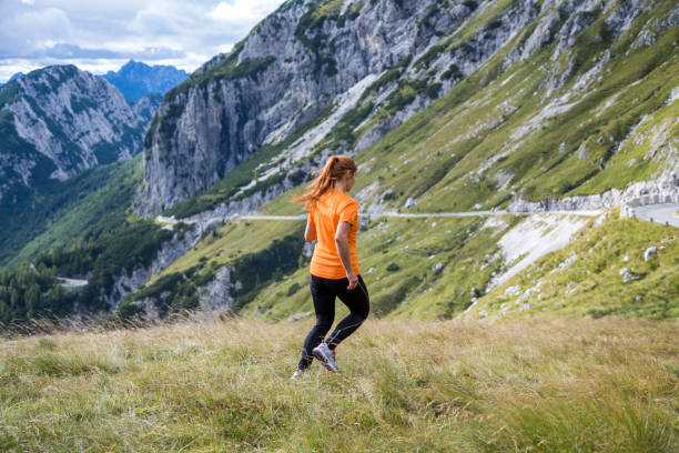 istock Woman running down the mountain 1126174665