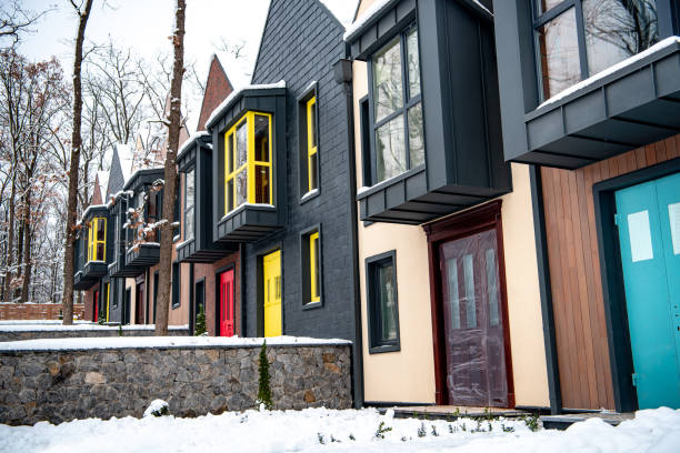 istock fancy modern houses with snow on ground near trees 1126174818