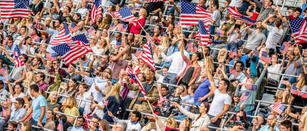 istock USA fans waving flags on a stadium 1126177123