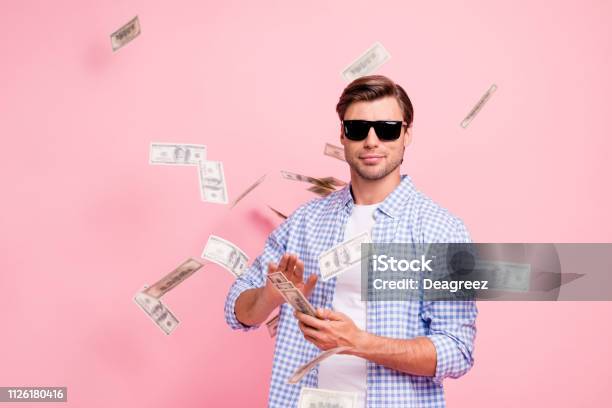 Portrait Of His He Nice Cool Trendy Content Attractive Handsome Candid Guy Wearing Checked Shirt Throwing Money Flying In Air Party Wealth Isolated Over Pink Pastel Background Stock Photo - Download Image Now