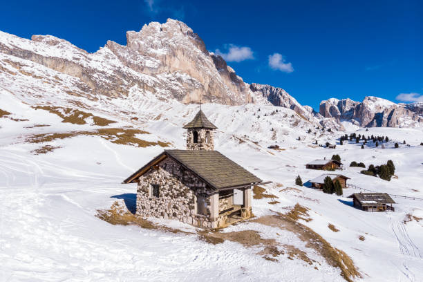 istock Dolomiti Mountains Italy winter snow church 1126182012