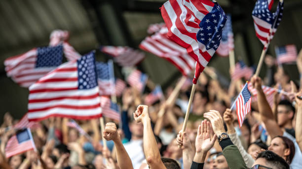 istock US fans waving their flags during a sports match 1126182178
