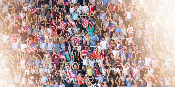 istock US fans waving their flags during a sports match 1126182244