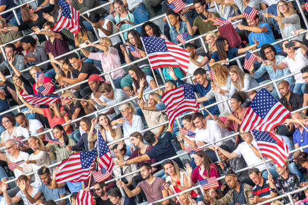 istock US fans waving their flags during a sports match 1126182257