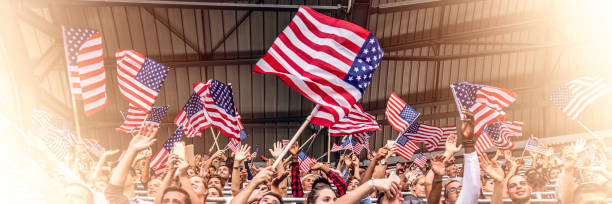 istock USA fans waving flags 1126182280