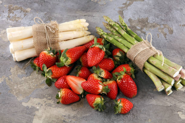 istock White and green asparagus with strawberries 1126182333