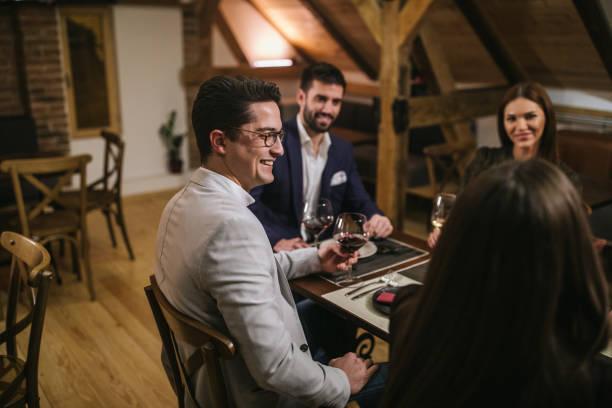 istock Handsome Man enjoying with friends 1126183171