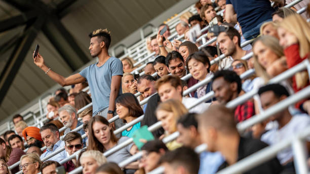 African-American man taking a selfie on a stadium