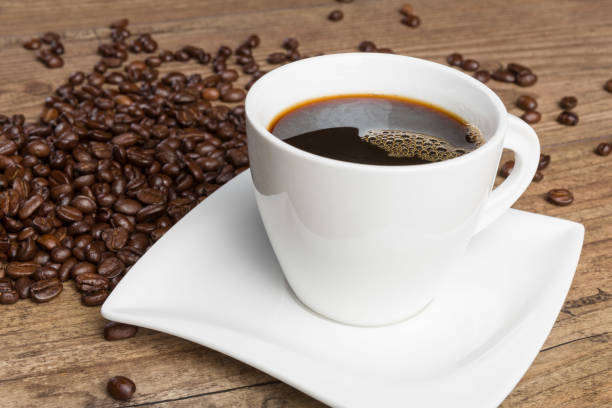 istock cup of coffee and coffee beans on a wooden table 1126183974