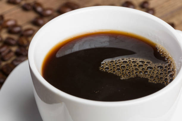 istock cup of coffee and coffee beans on a wooden table 1126183991