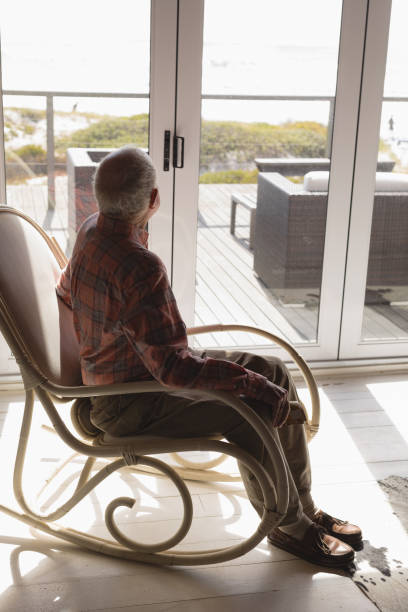 istock Senior man relaxing on rocking chair 1126185842