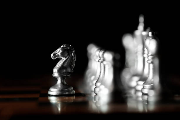 istock Pieces on chess board for playing game and strategy knight kingdom gaming 1126187717