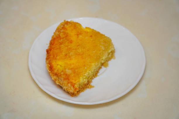 A piece of delicious cake on a white saucer. Selective focus