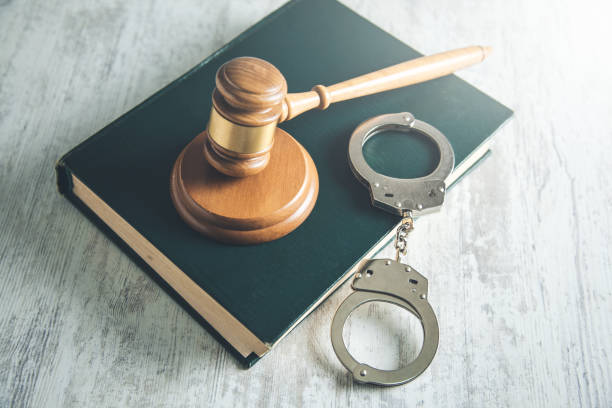 istock handcuffs and judge on books 1126200007