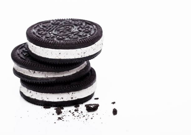 Ice Cream Sandwich with dark chocolate cookies on white background.Macro