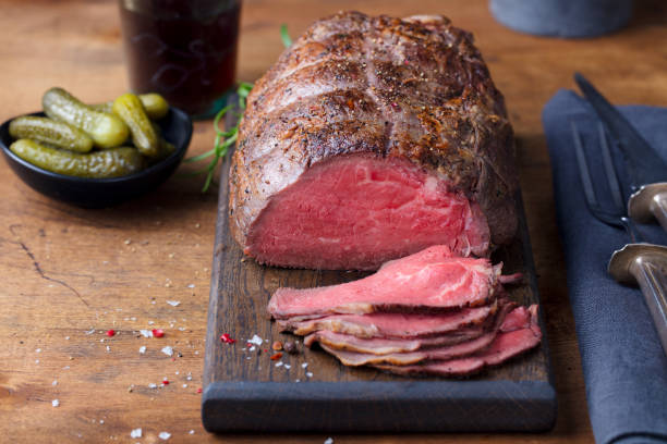istock Roast beef on cutting board. Wooden background. 1126202239