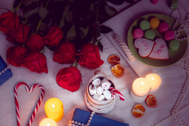 istock Candlelight dinner with red roses and gifts 1126202339