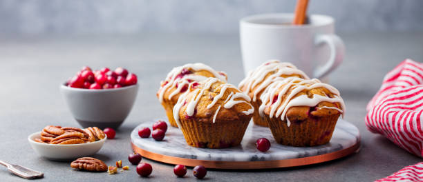 istock Muffins, cakes with cranberry and pecan nuts. Christmas decoration. 1126202776