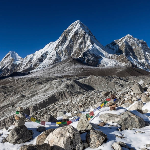 istock Buddhist prayer flags on mountain cairns on Everest Base Camp route in Himalayas, Nepal. 1126205996
