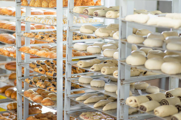 istock racks with finished and raw dough products in a bakery 1126210775