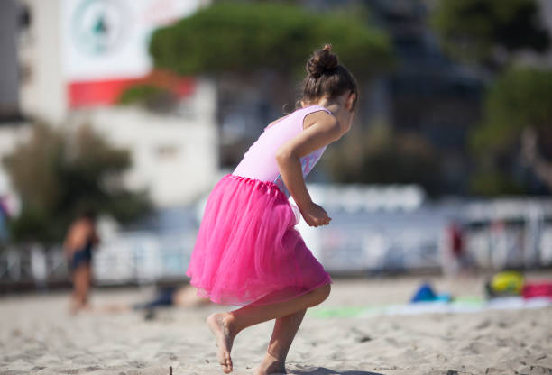 istock Little girl playing on the beach 1126211533
