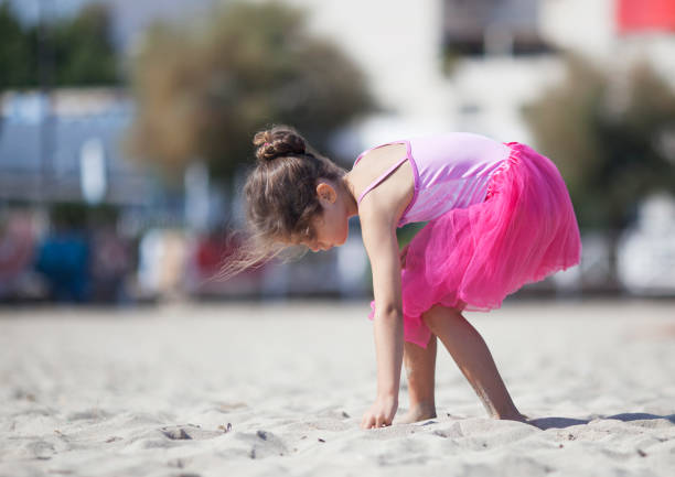 istock Little girl playing on the beach 1126211553