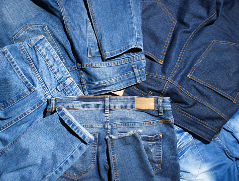 Background of many jeans pants
