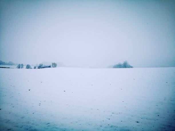 istock snow landscape with rural hills at dusk 1126215500