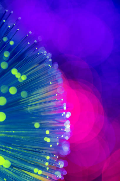 istock Fiber optics abstract background with defocused lights 1126217324