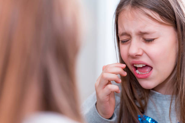 istock Girl crying in front of a mirror 1126220444