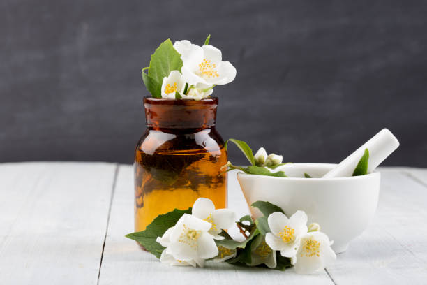istock Spa concept - making essential oil with jasmine flowers 1126224689