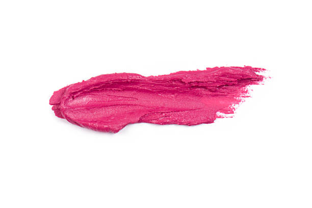 Pink lipstick smear smudge on white background close-up