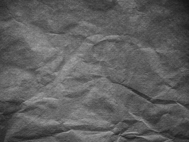 istock Thin, dark and gray paper with wrinkles on the skin 1126232449