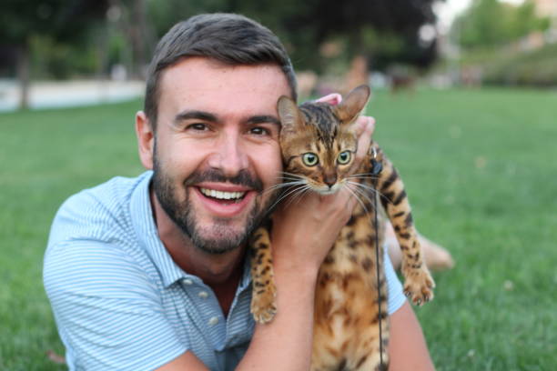 istock Handsome bachelor with his pet outdoors 1126232717