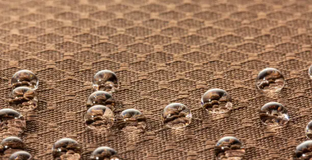 Water droplets on moisture resistant fabric Close up macro