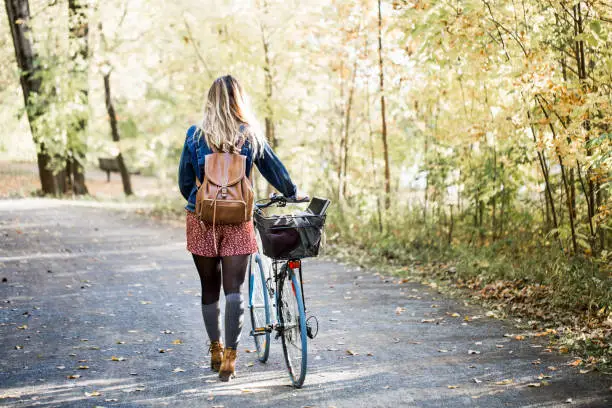 Photo of Portait of a beautiful young woman during fall season