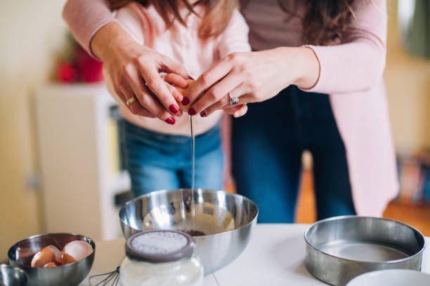istock Happy mother and daughter in kitchen 1126248882