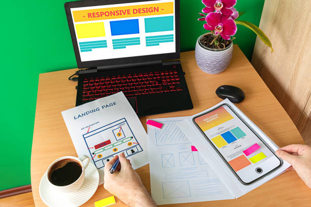 istock Web designer hand sketching responsive website for laptop and mobile phone 1126249583