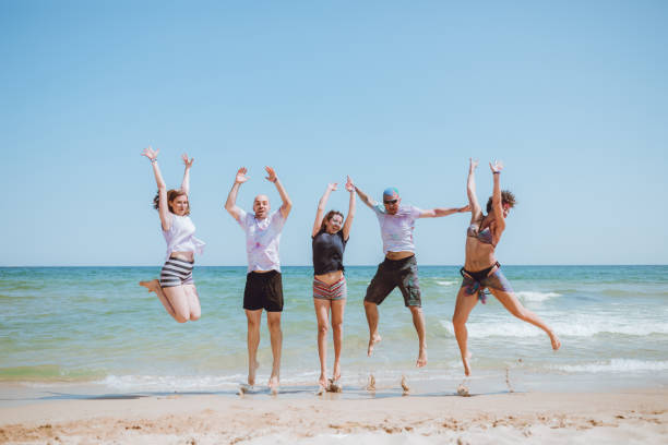 istock Jump of joy at the beach 1126249802