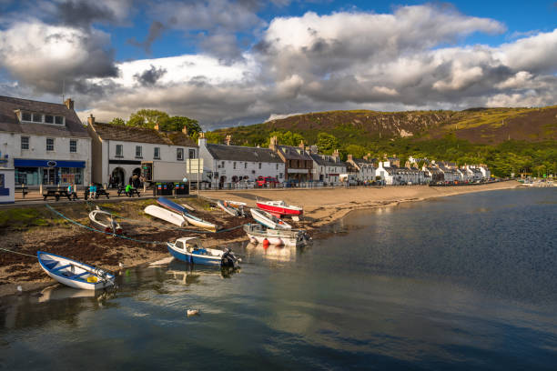 City Of Ullapool With Old Fishing Boat At Loch Broom In Scotland stock photo