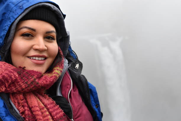 Young Woman in Scarf with Rain Jacket and Waterfall, Big Smile Melissa Hernandez modeling in Seattle steven harrie stock pictures, royalty-free photos & images